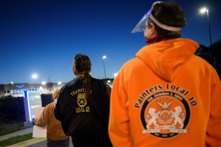 Union supporters distribute information before sunrise outside of the Amazon.com, Inc. BHM1 fulfillment center on March 29, 2021 in Bessemer, Alabama