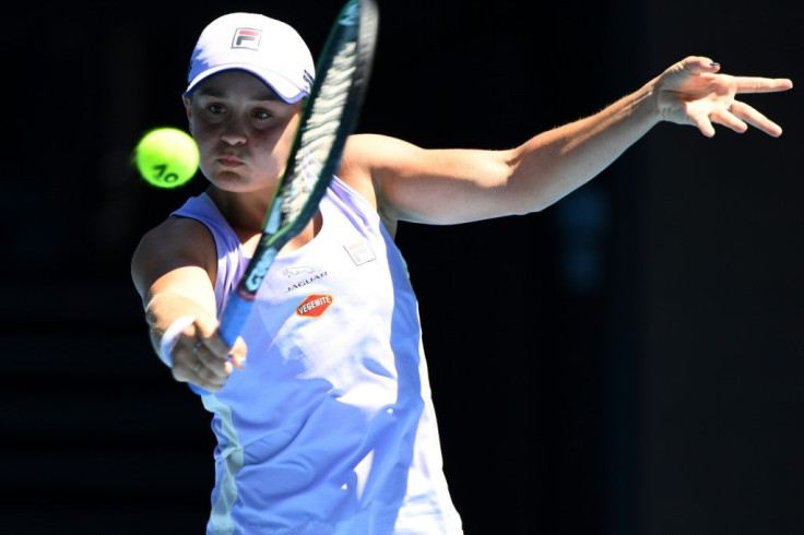 Top-ranked defending champion Ashleigh Barty battled into the quarter-finals by outlasting former world number one Victoria Azarenka 6-1, 1-6, 6-2