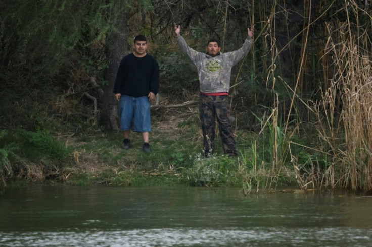 'Polleros,' as the human traffickers are known in Mexico, prepare to cross the Rio Grande into Texas on March 28 2021