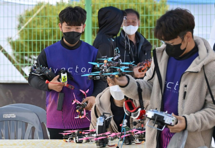 Racing drones are custom-built by competitors and their teams