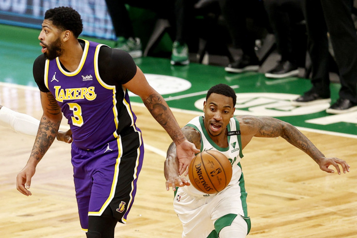 Jeff Teague #55 of the Boston Celtics steals the ball from Anthony Davis #3 of the Los Angeles Lakers