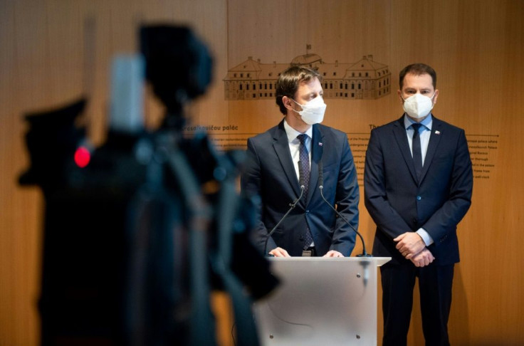 Heger (left) took over in a ceremony at the presidential palace Tuesday