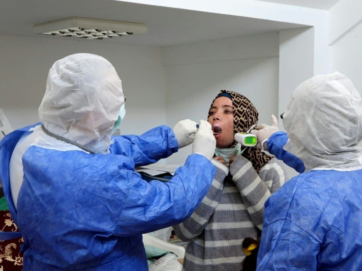 Medics examine a Syrian refugee