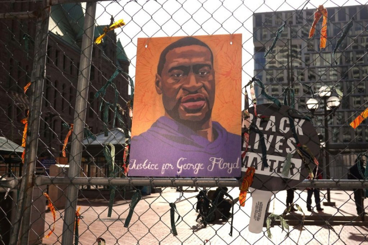 A picture of George Floyd on a fence that surrounds the Hennepin County Government Center where former Minneapolis police officer Derek Chauvin is on trial