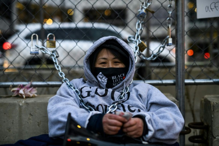 Teacher and activist Kaia Hirt chained herself to a fence outside the Hennepin County Government Center where former Minneapolis police officer Derek Chauvin is on trial for the death of George Floyd