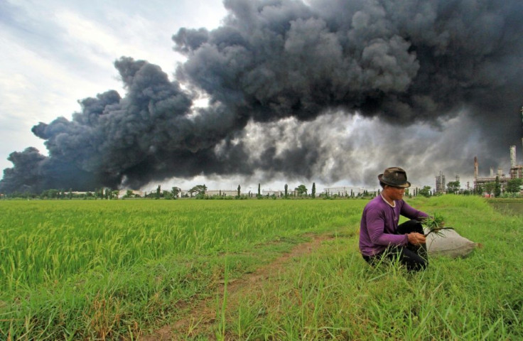 Thick plumes of black smoke shot into the sky at the Balongan refinery in West Java, owned by state oil company Pertamina