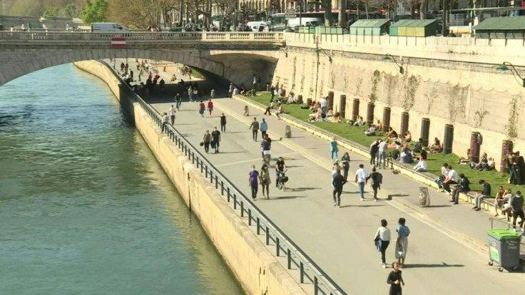 IMAGES Parisians take advantage of spring temperatures and generous sunshine to stroll and relax along the banks of the Seine, with many refusing to obey government mask mandates.