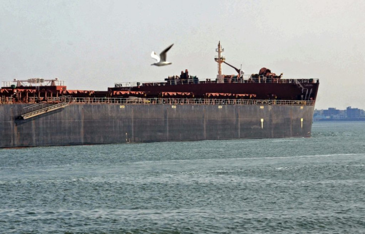 A ship on its way near Egypt's Suez Canal on March 30, 2021, a day after passage of the waterway was made possible once more by the dislodging of a giant container ship