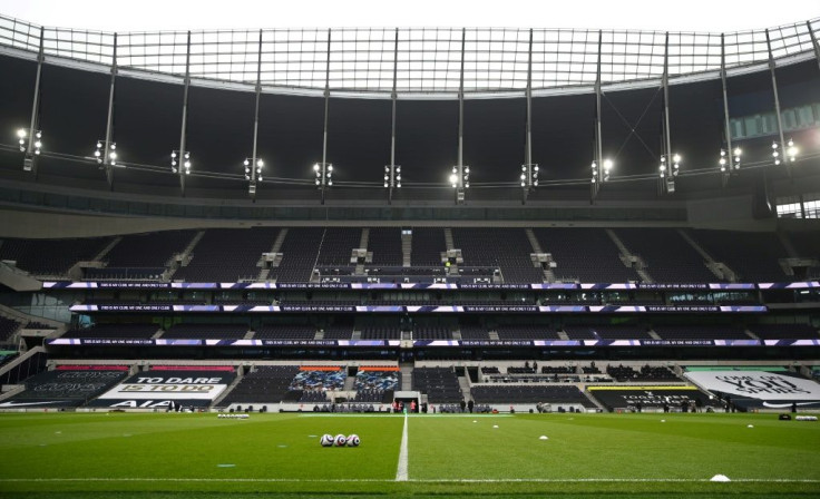 Empty seats are pictured in the empty stands ahead of the English Premier League football match between Tottenham Hotspur and Burnley at Tottenham Hotspur Stadium in London
