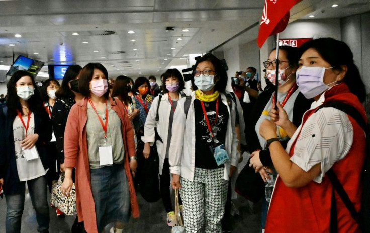 Excited tourists arrived at the airport about five hours before their flight in order to be tested for the coronavirus