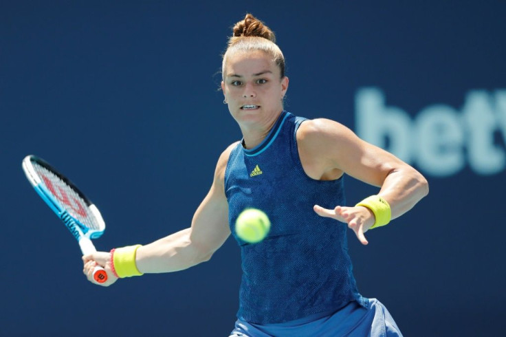 Greece's Maria Sakkari upset Japanese second seed Naomi Osaka in a WTA Miami Open quarter-final on Wednesday, snapping the Asian star's win streak at 23 matches
