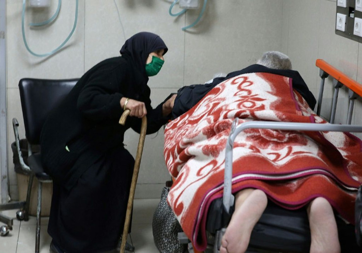 Syrians suspected of being infected with Covid-19 receive treatment at Mouwasat hospital in Damascus