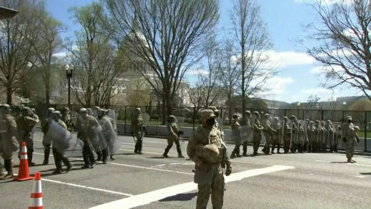 IMAGESMembers of the National Guard arrive on a street near the US Capitol after two police officers were injured when they were rammed by a vehicle whose driver was subsequently arrested.