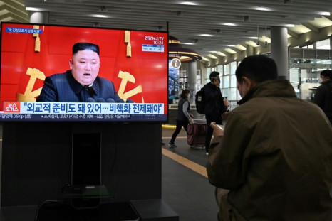 The United States held three-way talks with South Korea and Japan on how to handle North Korea, whose leader Kim Jong-Un is seen on a television screen in Seoul in March 2021