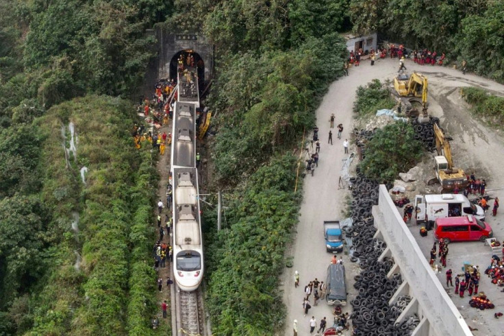 The crash, which killed at least 50 people and injured more than 170, was caused by a collision with a vehicle that slipped onto the tracks just as the train went into a narrow tunnel near the eastern coastal city of Hualien