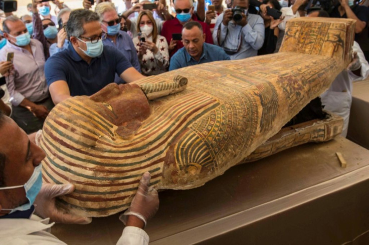 Egypt continues to unearth ancient remains - - this photograph from October 2020 shows the opening of a sarcophagus excavated by the Egyptian archaeological mission  at the Saqqara necropolis near Cairo