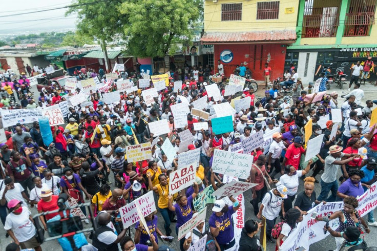 Protesters march in Port-au-Prince, Haiti on April 3, 2021