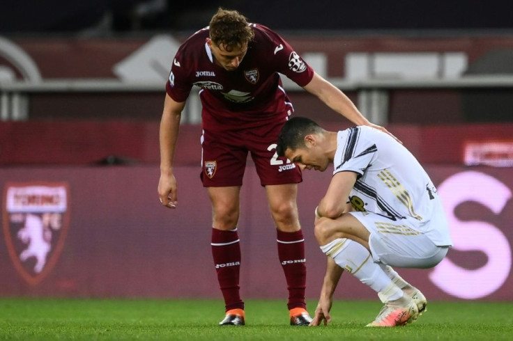 Torino defender Mergim Vojvoda (C) comforts Juventus' Cristiano Ronaldo after a 2-2 stalemate.