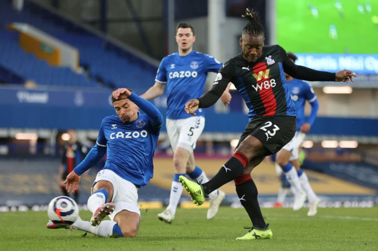 Bat man: Michy Batshuayi (right)dealt a blow to Everton's European hopes with a late equaliser for Crystal Palace