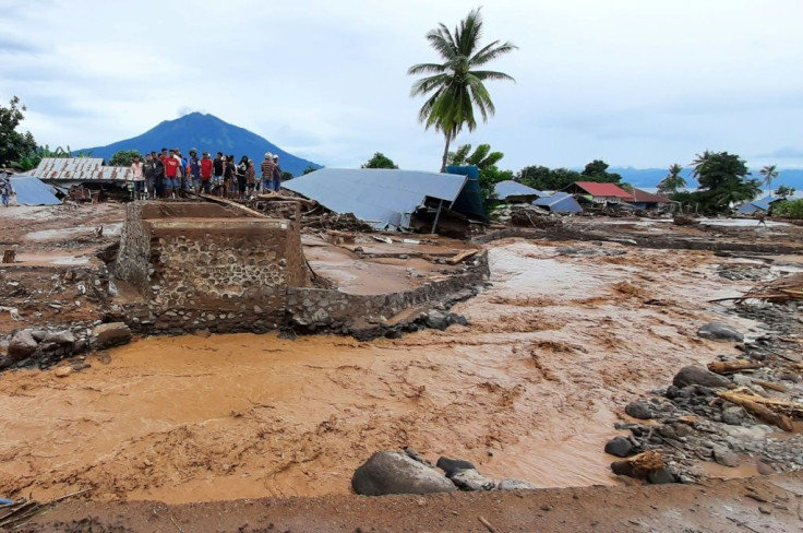 Torrents of mud washed over homes, bridges and roads in Indonesia's East Flores municipality