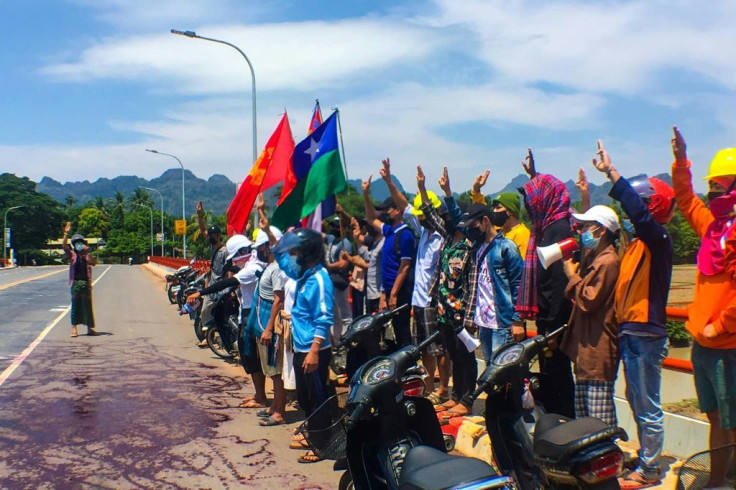 Protestors in Myanmar daubed roads with red paint to demonstrate against the military's bloody crackdown