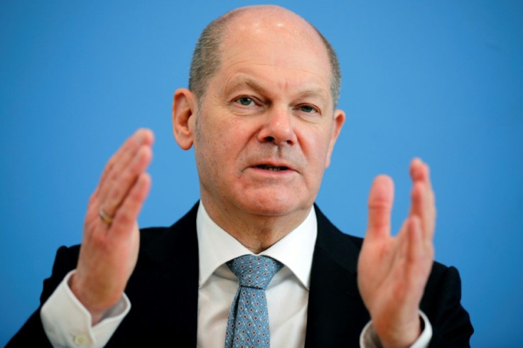 German Finance Minister Olaf Scholz says a global minimum corporate tax can "end the race to the bottom" on taxation.
