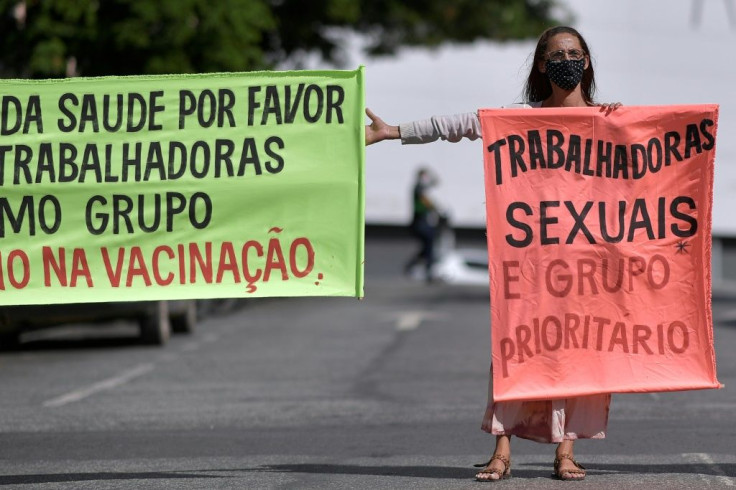 Sex workers protest at Rua Guaicurus, the main bohemian area of Belo Horizonte in Minas Gerais state, on April 5, 2021, asking to be considered a priority group to receive vaccines