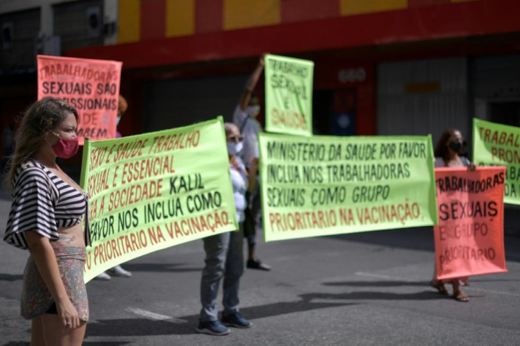 Sex workers protest at Rua Guaicurus, in Belo Horizonte, in Brazil's Minas Gerais state on April 5, 2021, asking to be considered a priority group to receive the vaccine against Covid-19
