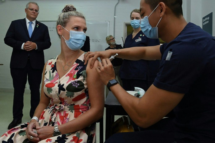 Australian Prime Minister Scott Morrison (L) has blamed his country's sluggish coronavirus vaccine rollout on EU supply issues