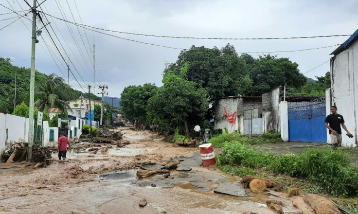 Rescuers have spent the past few days using diggers and shovels to extract mud-covered corpses from the debris