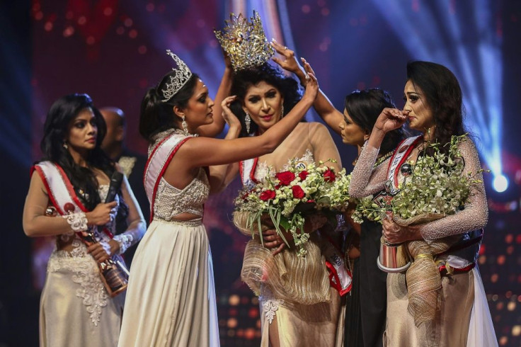 Caroline Jurie (2-L) was arrested on charges of assault over an on-stage fracas in which she pulled the crown off the head of the new "Mrs Sri Lanka"