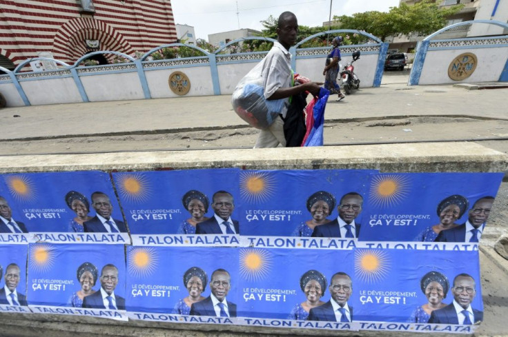 Talon, seen here with his running mate Mariam Talata on campaign posters in Cotonou, is expected to win on Sunday