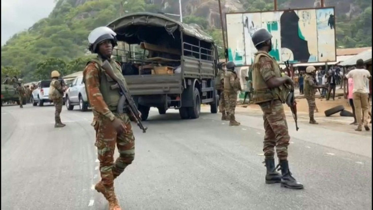 IMAGES Soldiers guard a major highway in Savè, central Benin, after dispersing demonstrators who blockaded road to protest against President Patrice Talon ahead of fresh elections on Sunday. One person was killed and six were wounded by gunfire in the se