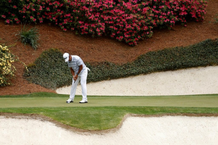 Japan's Hideki Matsuyama putts on the 12th green in the first round of the 2021 Masters at Augusta National Golf Club