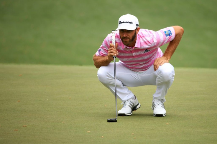 Defending champion Dustin Johnson lines up a putt in the first round of the 2021 Masters at Augusta National Golf Club