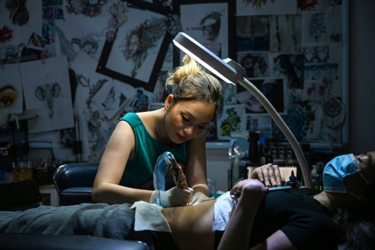 Ngoc was ridiculed when she started out as a tattoo artist in Hanoi less than a decade ago -- with many assuming she did not go into the industry out of choice