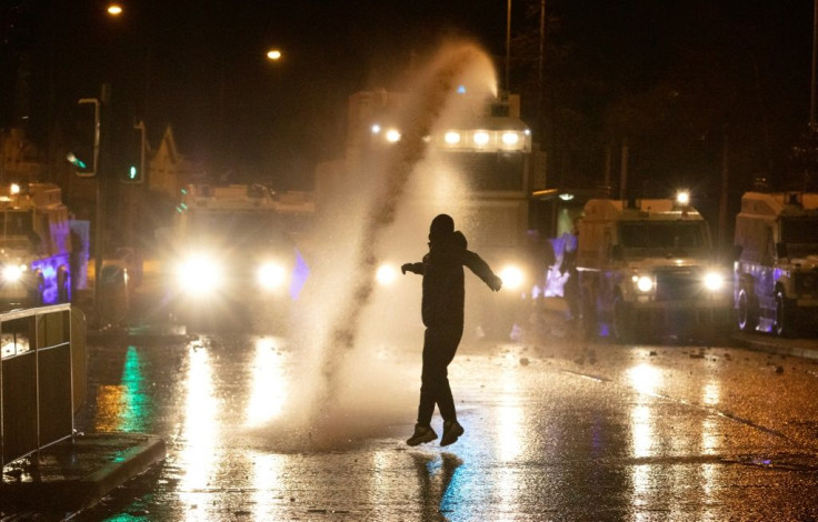 Masked and in hooded tops, rioters hurled rocks, bricks and glass bottles at police barricades