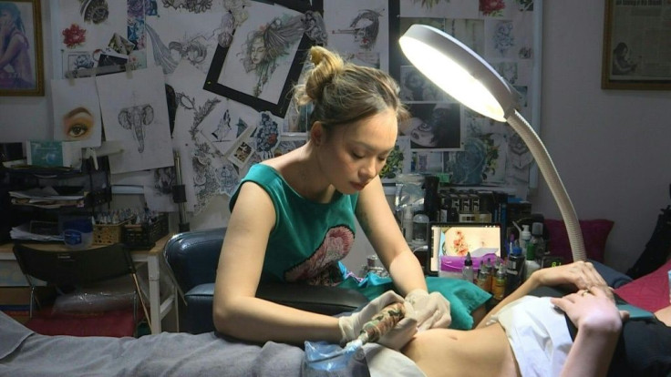 In her tiny Hanoi apartment, tattoo artist Ngoc inks middle-aged women whose lives been upended by divorce or illness, each of them searching for healing through an art form that is still largely taboo in Vietnam.