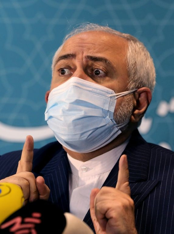 Iranian Foreign Minister Mohammad Javad Zarif, seen speaking in February 2021, has demanded the full lifting of US sanctions before Tehran returns to full compliance with a nuclear deal