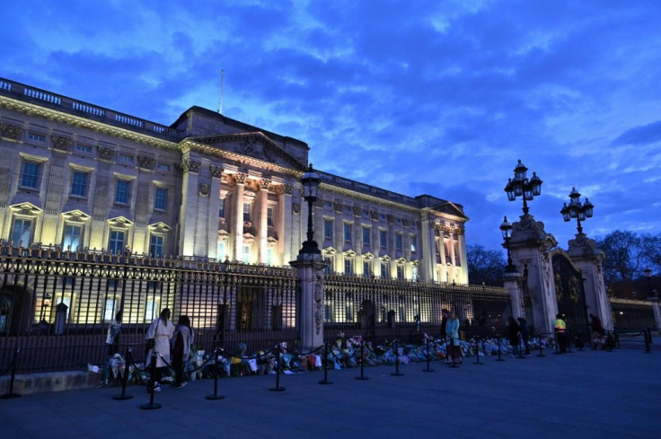 Well-wishers lay floral tributes outside Buckingham Palace in central London after the announcement of the death of Prince Philip