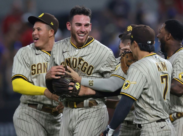 San Diego Padres pitcher Joe Musgrove, centre, is congratulated by his teammates after pitching a no-hitter against the Texas Rangers at Globe Life Field in Arlington, Texas