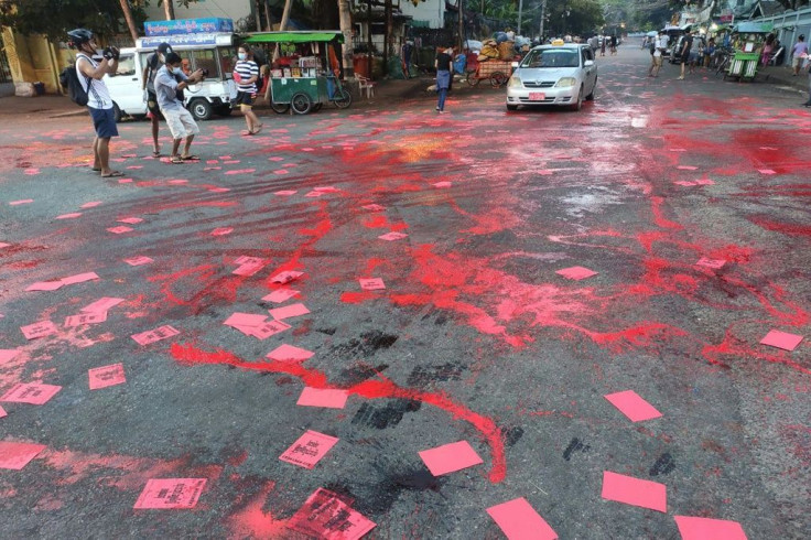 Yangon protesters splashed crimson paint across the streets