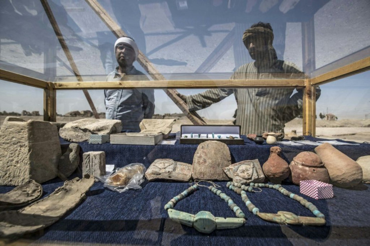 Archaeologists have unearthed items of jewellery, coloured pottery vessels, scarab beetle amulets and mud bricks bearing seals of Amenhotep III