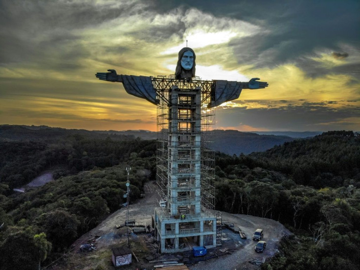 A head and arms have been added to the Christ the Protector statue being built in the southern Brazilian city of Encantado; it stands taller than Rio's iconic statue of Christ the Redeemer