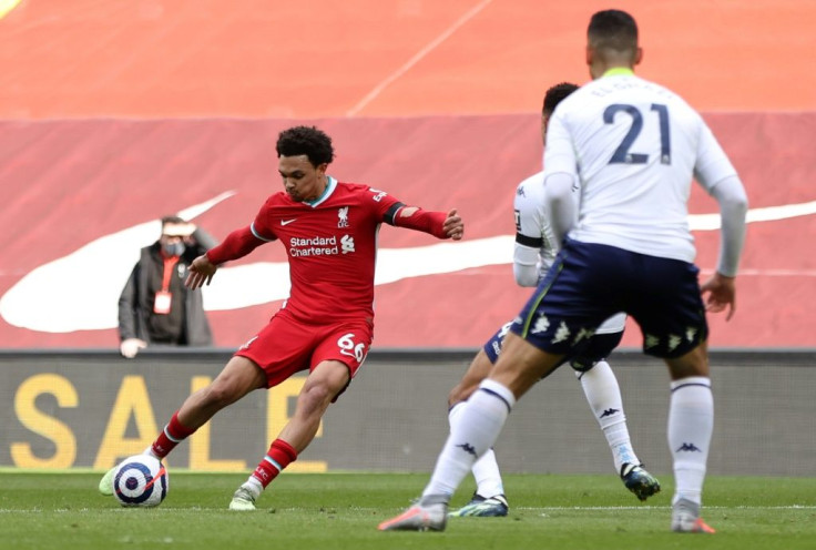 Liverpool defender Trent Alexander-Arnold (L) scores against Aston Villa