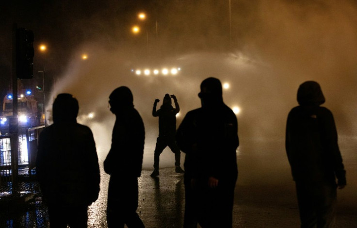 Police deployed a water cannon for the first time in years against rioters in Belfast on Thursday