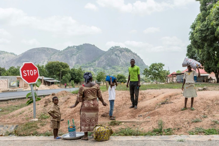 A family flees the central city of Save after protests erupted against President Patrice Talon