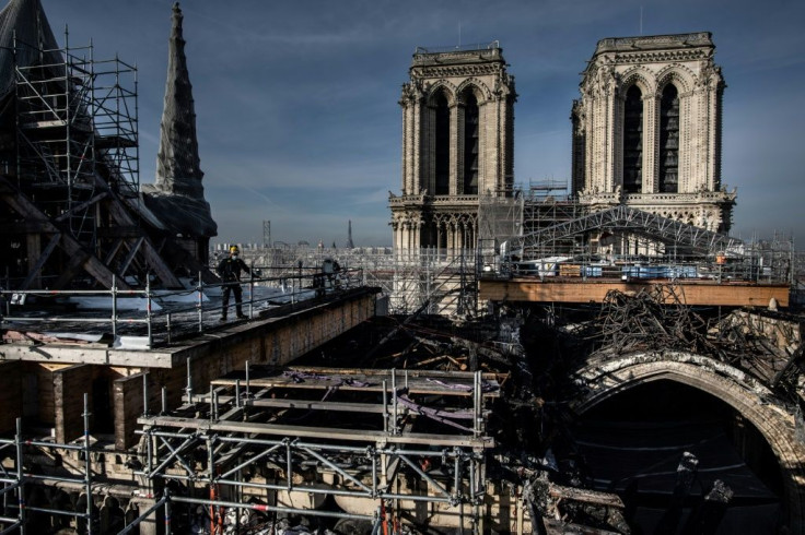 The first task for workers on Notre-Dame cathedral has been removing hundreds of tonnes of scaffolding that were damaged in the fire