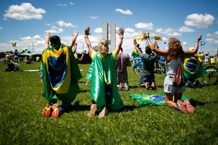 People take part in "The Christian Family March for Freedom" amid the ongoing COVID-19 coronavirus pandemic, in front of the Brazilian Congress in Brasilia