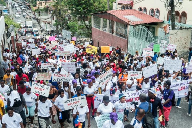 Haitians march in Port-au-Prince to commemorate the national day of the Haitian women's movement on April 3, 2021 -- the demonstrators denounced gang violence behind recent kidnappings and the government
